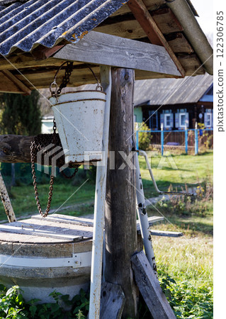 Close-up of an Old Village Well with Bucket Close-up of an Old Village Well with Bucket 122306785