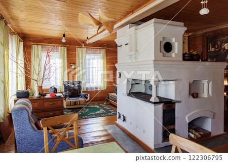 Traditional Russian Stove in Cozy Wooden House Interior Traditional Russian Stove in Cozy Wooden House Interior 122306795