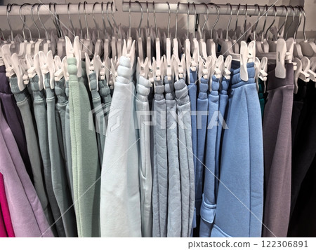 Colors of comfort hang beautifully on display in a trendy clothing store 122306891