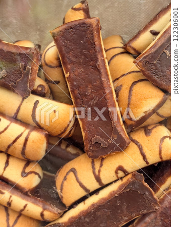 Sweet treats of rich chocolate and crispy biscuits delighting taste buds Sweet treats of rich chocolate and crispy biscuits delighting taste buds 122306901