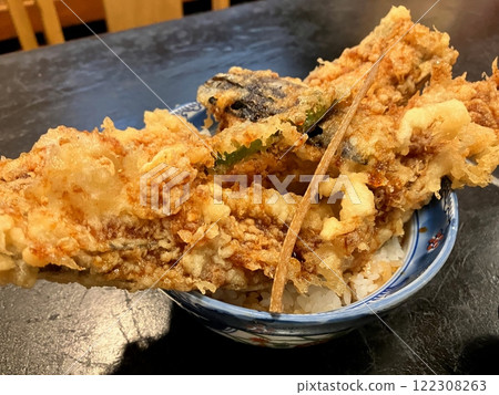Conger eel tempura bowl: A bowl of tempura with a large conger eel that overflows from the bowl 122308263