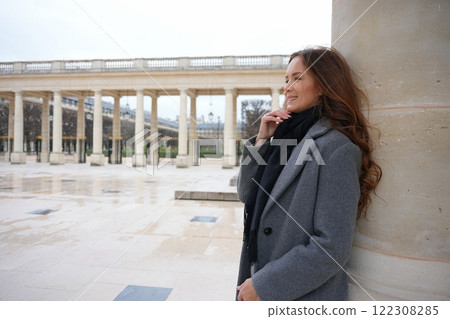 Smiling Woman Leaning on Column in Palais Royal, Paris Smiling Woman Leaning on Column in Palais Royal, Paris 122308285