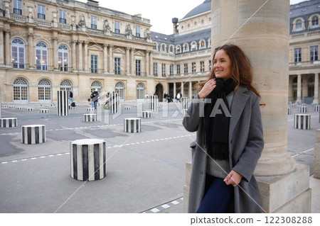 Smiling Woman at Palais Royal with Modern Art Installation in Paris Smiling Woman at Palais Royal with Modern Art Installation in Paris 122308288