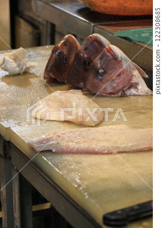 Fresh fish preparation: Red sea bream filleted into three pieces Fresh fish preparation: Red sea bream filleted into three pieces 122308685