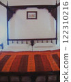 A hotel bed in Agra, India 122310216