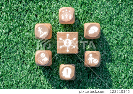 Wooden blocks on grass symbolize essential soft skills like communication, teamwork, and leadership in a modern workplace. Wooden blocks on grass symbolize essential soft skills like communication, teamwork, and leadership in a modern workplace. 122310345