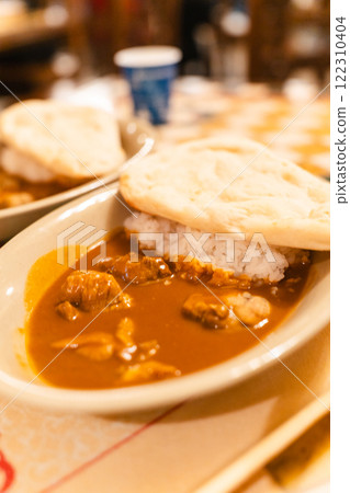 Naan and rice curry 122310404