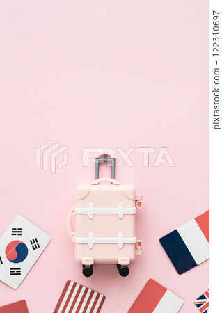 Suitcase and flag travel pink background 122310697