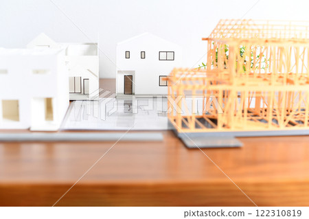 Image of a house/real estate model placed on a desk 122310819