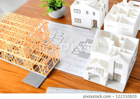 Image of a house/real estate model placed on a desk 122310820