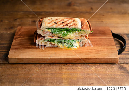 Mustard greens and bacon cheese hot sandwich Mustard greens and bacon cheese hot sandwich 122312713