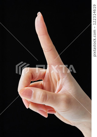 Making a touching gesture with your index finger Making a touching gesture with your index finger 122314619