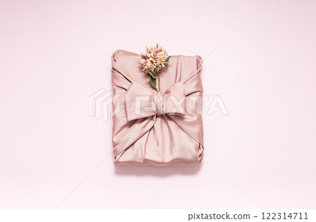 Gift box wrapped in reusable fabric, decorated dried flower. Gift box wrapped in reusable fabric, decorated dried flower. 122314711