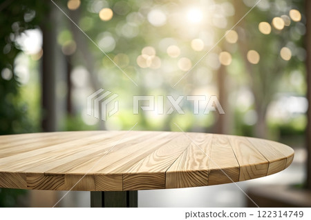 Photorealistic image of a wooden table top with a blurred background of a bright, sunny forest Photorealistic image of a wooden table top with a blurred background of a bright, sunny forest 122314749
