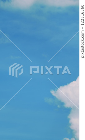 Beautiful Sky Background. Blue Sky With Clouds As Blue Backdrop In Air. Blue Sky With White Clouds. Vertical Time Lapse. Beautiful Sky Background. Blue Sky With Clouds As Blue Backdrop In Air. Blue Sky With White Clouds. Vertical Time Lapse. 122316360