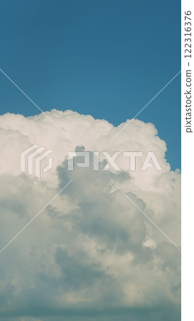 Nature Weather Blue Sky Day Light. Floating Transforming Cumulus Clouds On A Sunny Day. Vertical Time Lapse. Nature Weather Blue Sky Day Light. Floating Transforming Cumulus Clouds On A Sunny Day. Vertical Time Lapse. 122316376