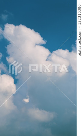 Motions Clouds Puffy Fluffy White Clouds Sky. Potential For Natural Or Climate Projects. Vertical Time Lapse. 122316396