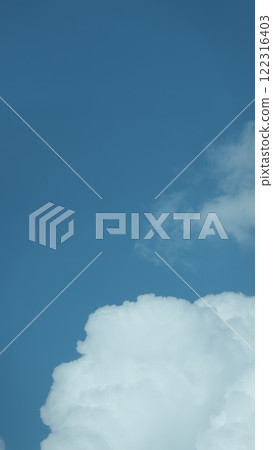 Blue Nature Sky Background And Clouds. Beautiful White Cloud On Clear Blue Sky As Nature Concept. Vertical Time Lapse. 122316403