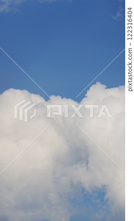 Blue Sky Background With Tiny Clouds. Low Angle View. Blue Clear Sky And White Clouds. Vertical Time Lapse. Blue Sky Background With Tiny Clouds. Low Angle View. Blue Clear Sky And White Clouds. Vertical Time Lapse. 122316404