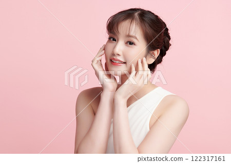 Beautiful young asian woman with clean fresh skin on pink background, Face care, Facial treatment, Cosmetology, beauty and spa, Asian women portrait. 122317161