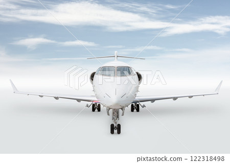 Front view of the white luxury executive airliner isolated on bright background with sky Front view of the white luxury executive airliner isolated on bright background with sky 122318498