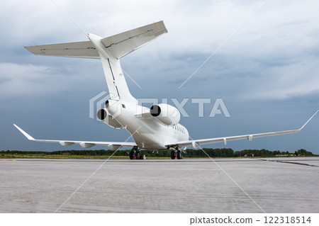 White luxury executive aircraft on the airport apron on a cloudy day 122318514