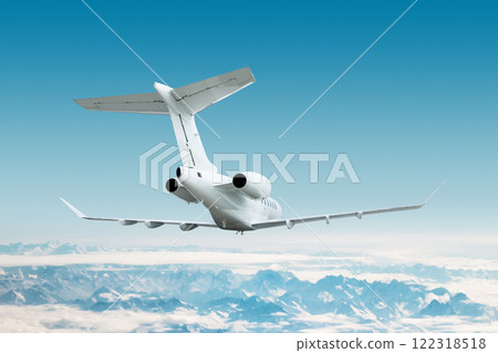 White luxury executive airplane flying over snow covered mountain ranges White luxury executive airplane flying over snow covered mountain ranges 122318518