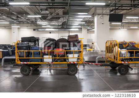 Baggage trolleys with luggage in the baggage compartment of the airport 122318610