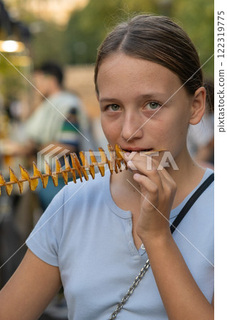 Girl Eating Potato Chips Spiral Girl Eating Potato Chips Spiral 122319775