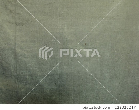 texture of rough tarpaulin fabric dirty green color close-up, fabric background of awning or camouflage macro view, old wrinkled dirty shabby canvas as an empty backdrop texture of rough tarpaulin fabric dirty green color close-up, fabric background of awning or camouflage macro view, old wrinkled dirty shabby canvas as an empty backdrop 122320217