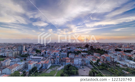 Rooftops of Porto's old town on a warm spring day timelapse during sunset, Porto, Portugal 122320740