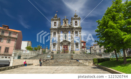 Church of Saint Ildefonso timelapse hyperlapse, covered with typical Portuguese tiles called Azulejos in Porto, Portugal. Church of Saint Ildefonso timelapse hyperlapse, covered with typical Portuguese tiles called Azulejos in Porto, Portugal. 122320744