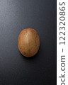 Single kiwi fruit on a black background Single kiwi fruit on a black background 122320865