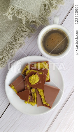 Flat lay of Dubai style chocolate with pistachio Flat lay of Dubai style chocolate with pistachio 122320993