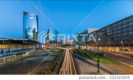 Milan skyline with modern skyscrapers in Porta Nuova business district day to night timelapse in Milan, Italy, after sunset. 122321935