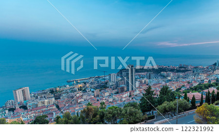 Cityscape of Monte Carlo, Monaco day to night timelapse with roofs of buildings after summer sunset. 122321992