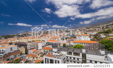 Aerial view from the mountain over the rooftops from cable car on Madeira timelapse hyperlapse. Aerial view from the mountain over the rooftops from cable car on Madeira timelapse hyperlapse. 122322155