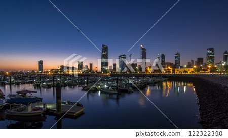 Yachts and boats at the Sharq Marina night to day timelapse in Kuwait. Kuwait City, Middle East Yachts and boats at the Sharq Marina night to day timelapse in Kuwait. Kuwait City, Middle East 122322390