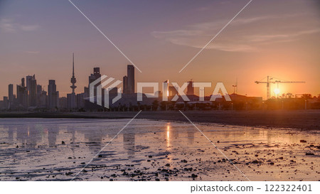 Seaside skyline of Kuwait city sunrise timelapse 122322401