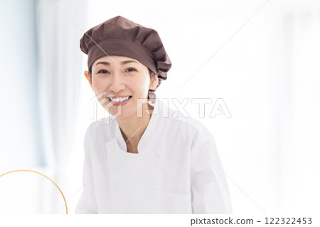 Middle-aged pastry chef working at a hotel 122322453