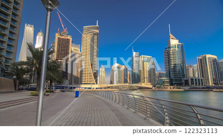 Dubai Marina with tallest skyscrapers and boats timelapse hyperlapse 122323113