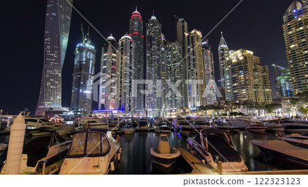 Dubai Marina with tallest skyscrapers and boats night timelapse hyperlapse 122323123