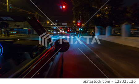 Car moves at fast speed at the night streets timelapse hyperlapse drivelapse. Car moves at fast speed at the night streets timelapse hyperlapse drivelapse. 122323126