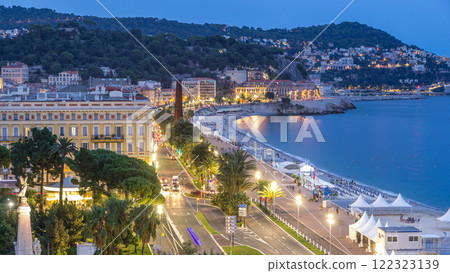 Evening aerial panorama of Nice day to night timelapse, France. Lighted Old Town little streets and waterfront after sunset Evening aerial panorama of Nice day to night timelapse, France. Lighted Old Town little streets and waterfront after sunset 122323139