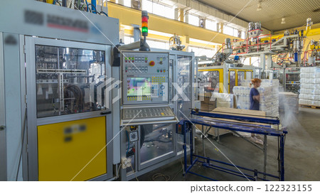 A factory for plastic canister production timelapse hyperlapse. The conveyor in the factory. 122323155