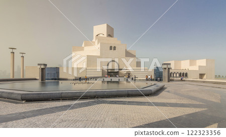 Qatar's museum of Islamic Art timelapse hyperlapse on its man-made island beside Doha Corniche 122323356
