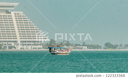 A dhow going to harbour in Doha timelapse, Qatar A dhow going to harbour in Doha timelapse, Qatar 122323368