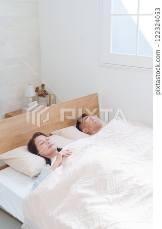 Senior couple sleeping in bed (sleep/health) 122324053
