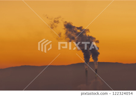 Industrial Pollution at Sunset Witness a Dramatic Sky Illuminated by Emissions and by Nature 122324054