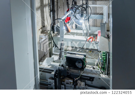 The elevator mechanisms are visible through the open doors, the equipment is being repaired after replacement, installation or breakdown, and maintenance. Advanced Robotics Machinery and Equipment in 122324055